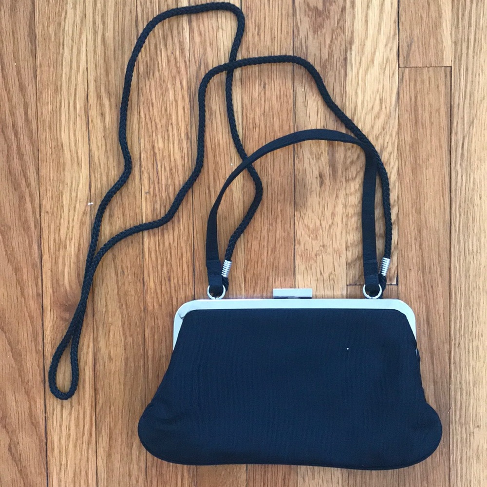 Black formal mini purse with snap closure and optional shoulder strap